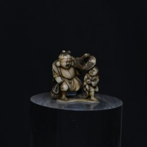 Netsuke Hotei and boy ivory